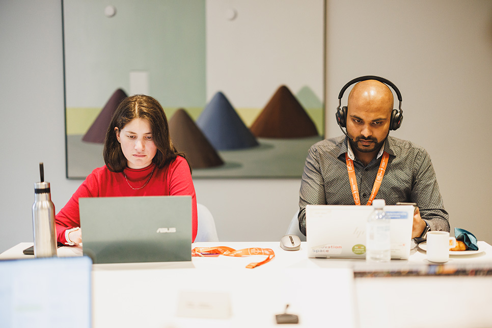 woman and man working on laptops