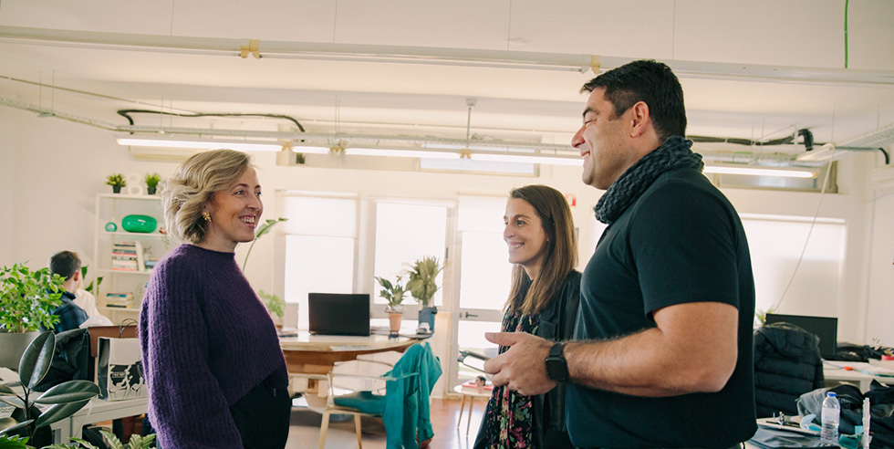 3 people talking and smilling